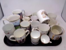 A tray of commemorative mugs, tankards and loving cups together with two further tankards,