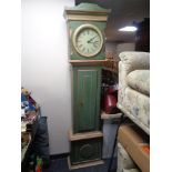 An antique continental painted longcase clock with circular dial,