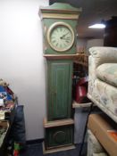 An antique continental painted longcase clock with circular dial,