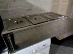 A commercial stainless steel three pot bain marie