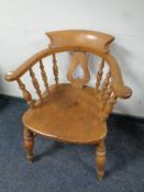 An antique elm and beech smoker's armchair
