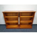 A pair of yew wood open bookshelves