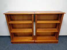 A pair of yew wood open bookshelves