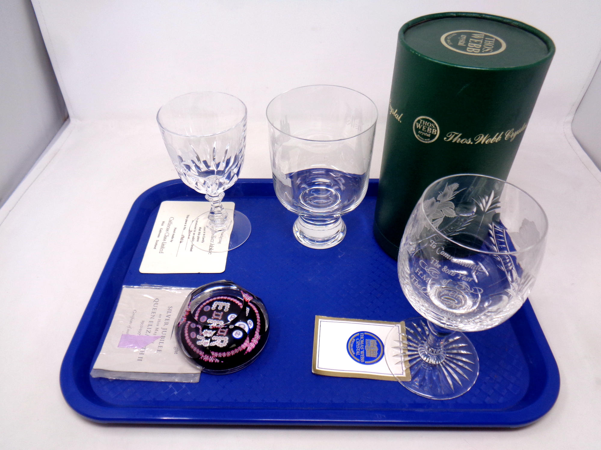A tray of four pieces of glass ware to include Thomas Webb crystal goblet in box,