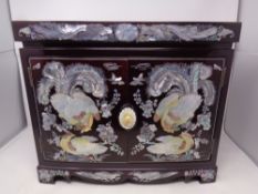 A Japanese style mother of pearl inlaid double door jewellery chest fitted eight internal drawers,