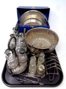 A tray of antique and later plated wares, three four-piece cut glass cruet sets, toast rack,