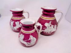 Three graduated Victorian jugs decorated with panels of Roman chariots