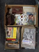 A box and case containing cameras, photographic magazines, postcards,