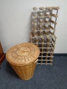 Two metal and pine wine racks together with a wicker laundry basket with lid