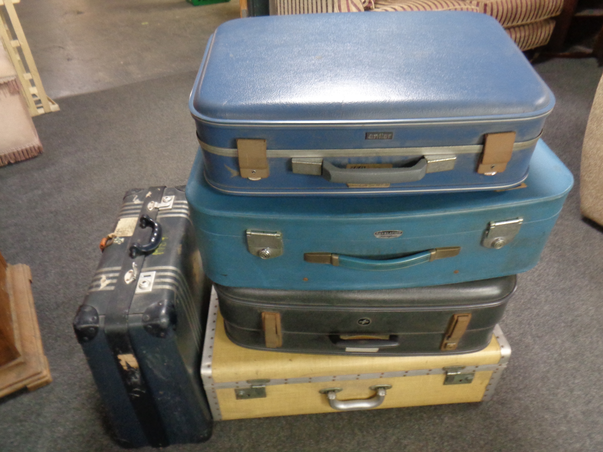 Five 20th century luggage cases to include Revelation, Antler,