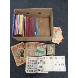 A box of Oor Wullie and The Broons annuals, two 20th century stamp albums containing world stamps,