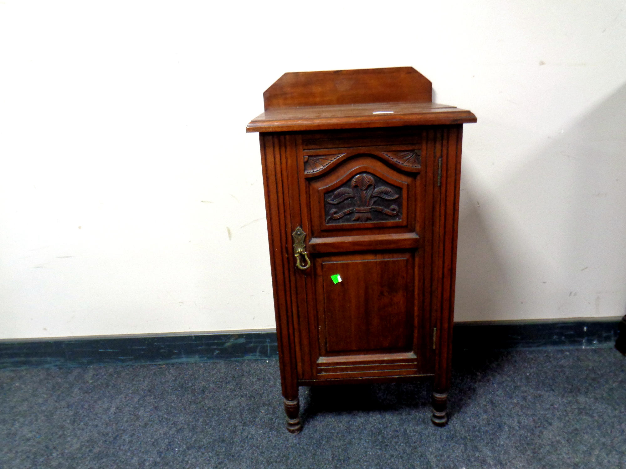 An Edwardian mahogany pot cupboard,