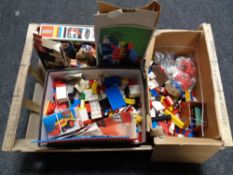 A crate of vintage lego and lego boxes