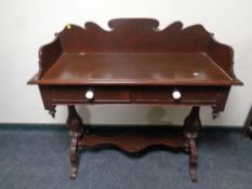 A late Victorian painted two drawer wash stand