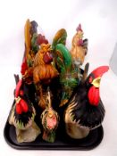 A tray of eight pottery cockerel ornaments,