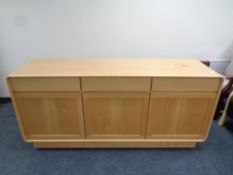 A late 20th century Danish sideboard fitted three drawers above in a pine finish