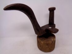 A 19th century cast iron cobbler's last on wooden stand