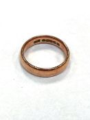 A 9ct gold band ring, size P. CONDITION REPORT: 4.