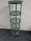 An iron five tier pan stand