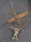 A cast iron armillary spear on atlas base