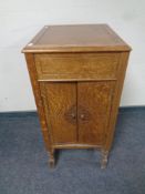 An Edwardian oak gramophone cabinet