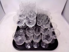 A tray of assorted cut glass and lead crystal drinking glasses