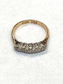An 18ct gold and platinum five stone diamond ring, size J. CONDITION REPORT: 2.