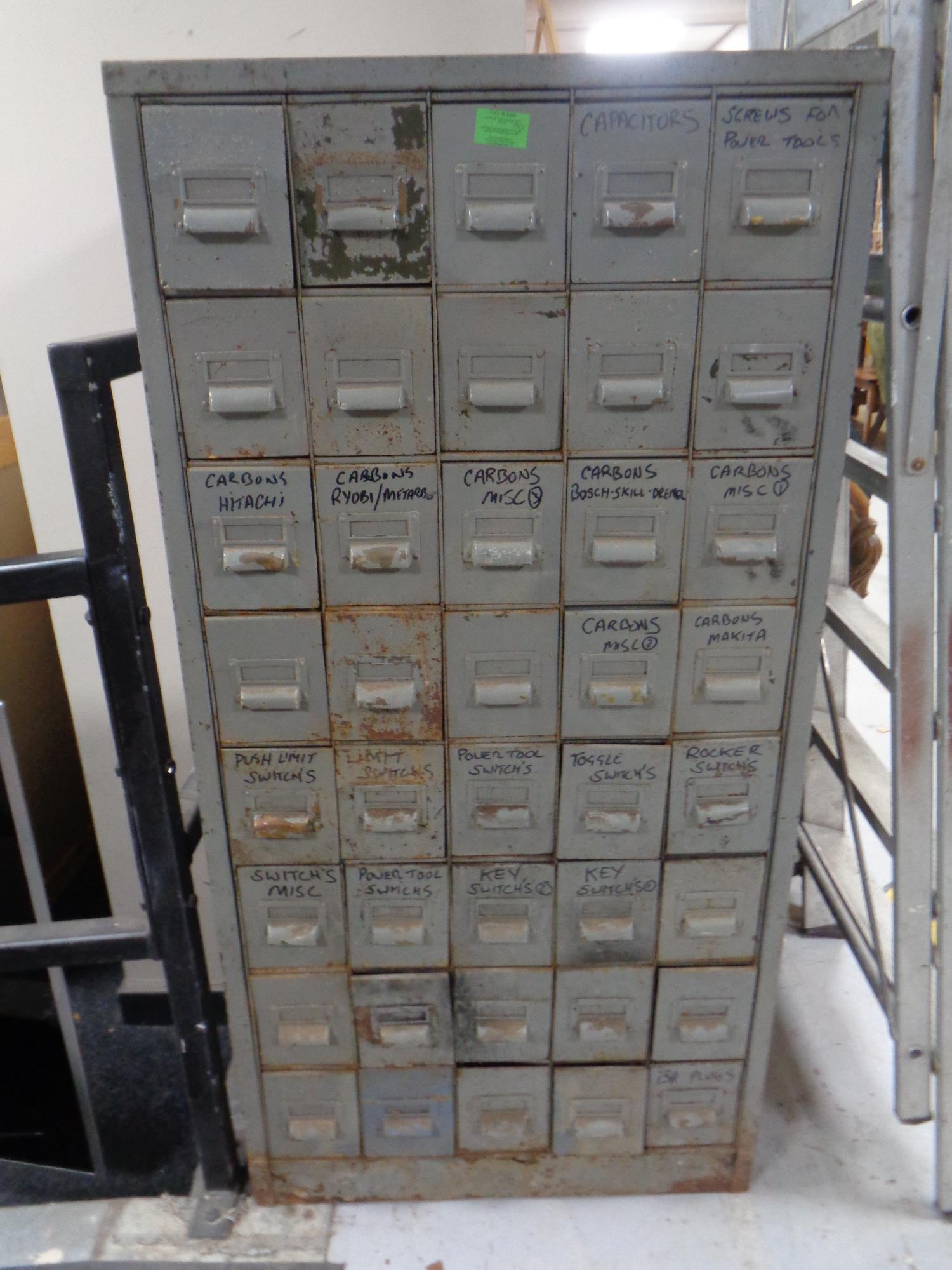 A mid century metal forty drawer index chest