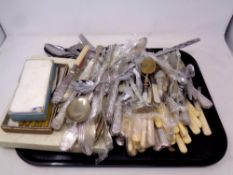 A tray of boxed and un-boxed stainless steel and plated cutlery