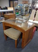 An Art Deco burr walnut concave dressing table fitted a drawer,