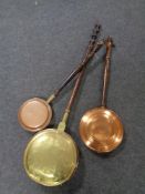 Three bed warming pans, copper and brass.