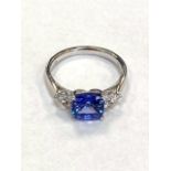 An 18ct white gold tanzanite and diamond ring, tanzanite 1.59ct and diamond shoulders 0.