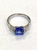 An 18ct white gold tanzanite and diamond ring, tanzanite 1.59ct and diamond shoulders 0.