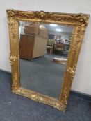 A 19th century mirror in a gilt composite frame