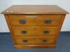 An Edwardian satin wood three drawer chest