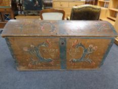 A 19th century hand painted domed-topped shipping trunk with key