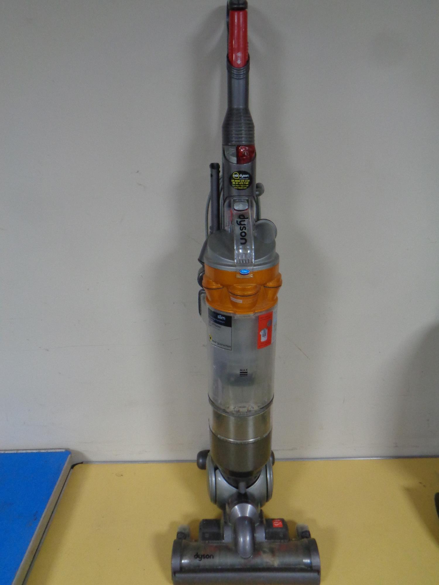 A Dyson DC 18 slim upright vacuum cleaner