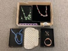 A small collection of costume jewellery, necklaces, evening bag etc.