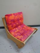 A 20th century plywood and beech low lounge chair