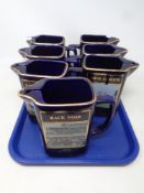 A tray of seven Martel Grand National limited edition jugs