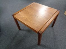 A mid 20th century Jens Risom square teak coffee table