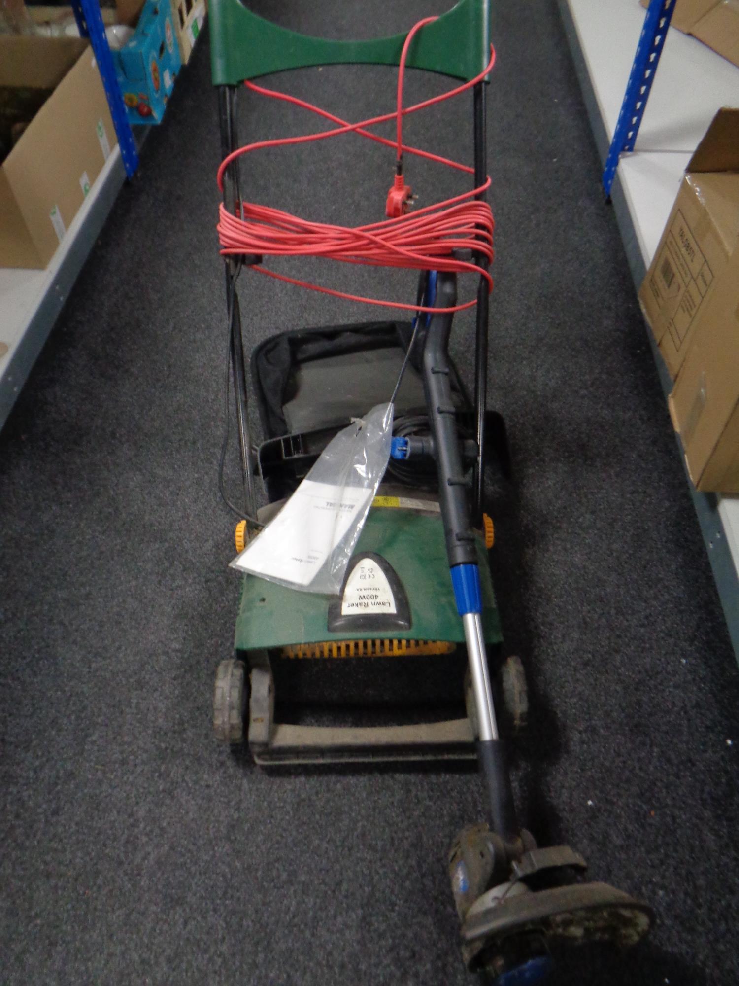 A 400w electric lawn raker and an electric strimmer