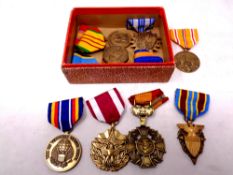 Ten American war medals on ribbons
