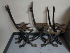 A set of eight antique cast iron bench and table legs