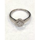 An 18ct white gold fancy diamond cluster ring with diamond shoulders, approximately 0.35ct, size L.