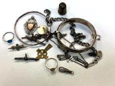 A group of silver including two bangles, RAF brooch, crucifixes,
