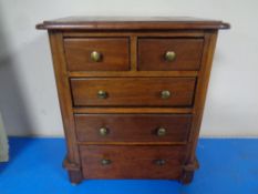 A 19th century mahogany miniature five drawer chest,