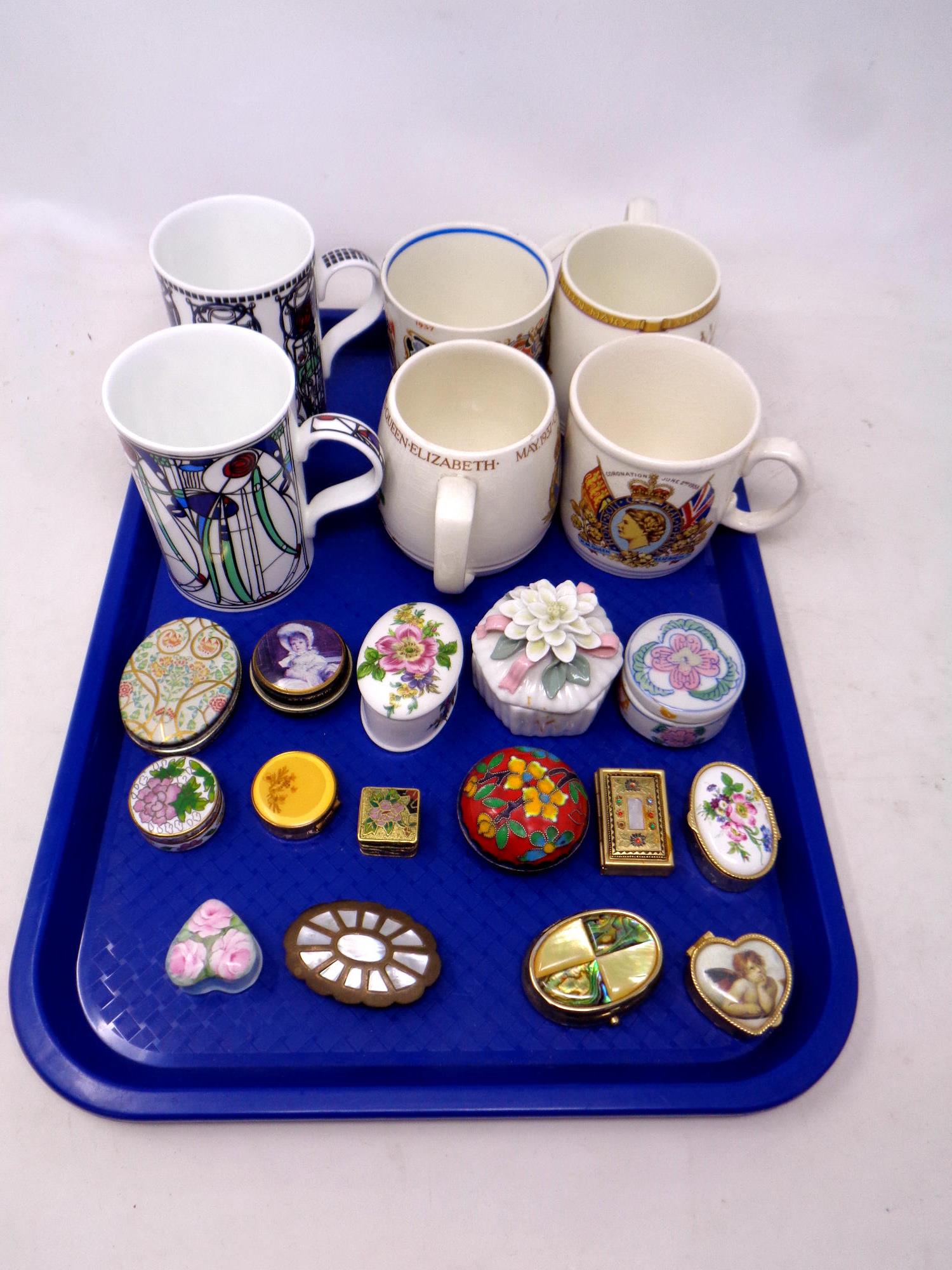 A tray of ceramic and metal lidded pill and trinket boxes, pair of Mackintosh Art Deco mugs,