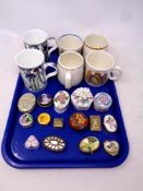 A tray of ceramic and metal lidded pill and trinket boxes, pair of Mackintosh Art Deco mugs,