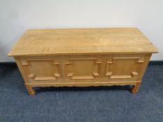 A blonde oak blanket box